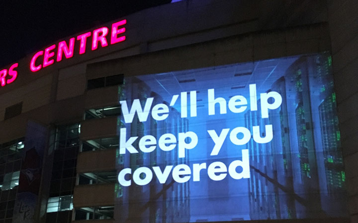 Large outdoor LED screen displaying captivating ads in a bustling cityscape | Meta OOH