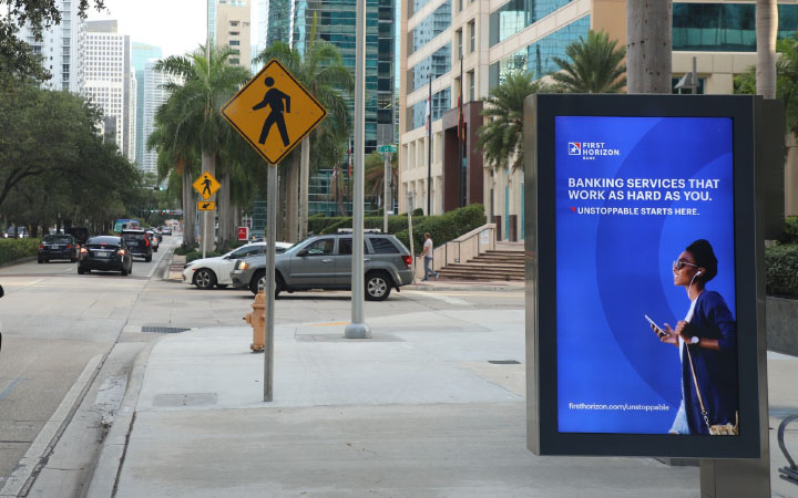 Digital advertising display showcasing engaging content in an urban environment | Meta OOH